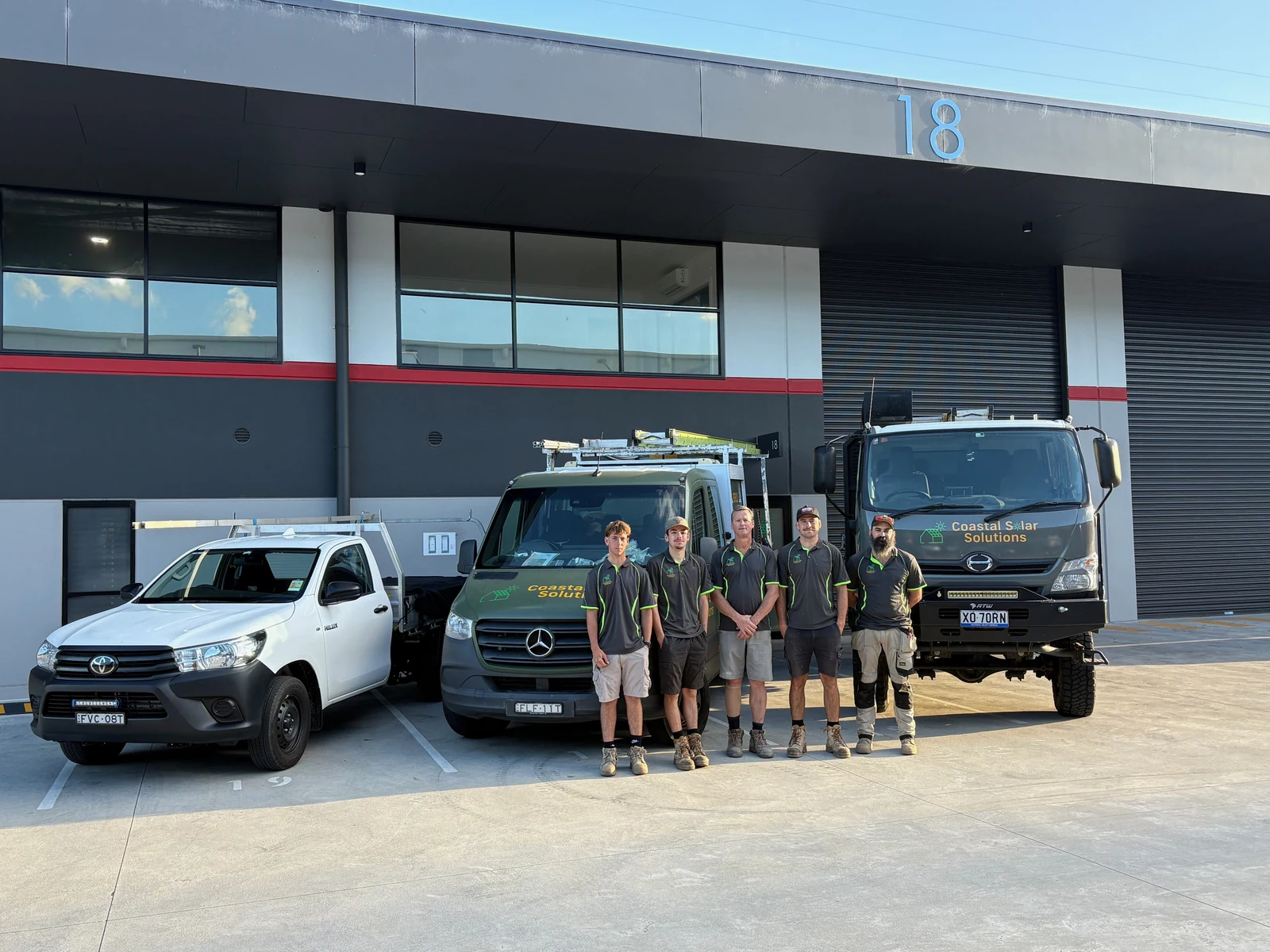 The Coastal Solar Solutions crew with their vehicles